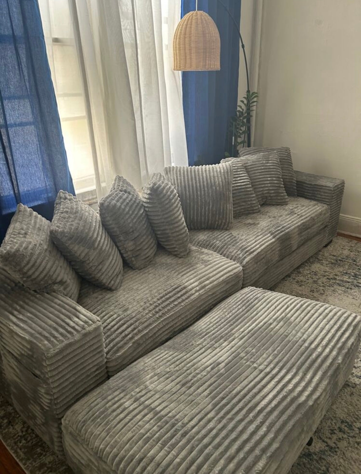 Plush gray corduroy sectional with ottoman